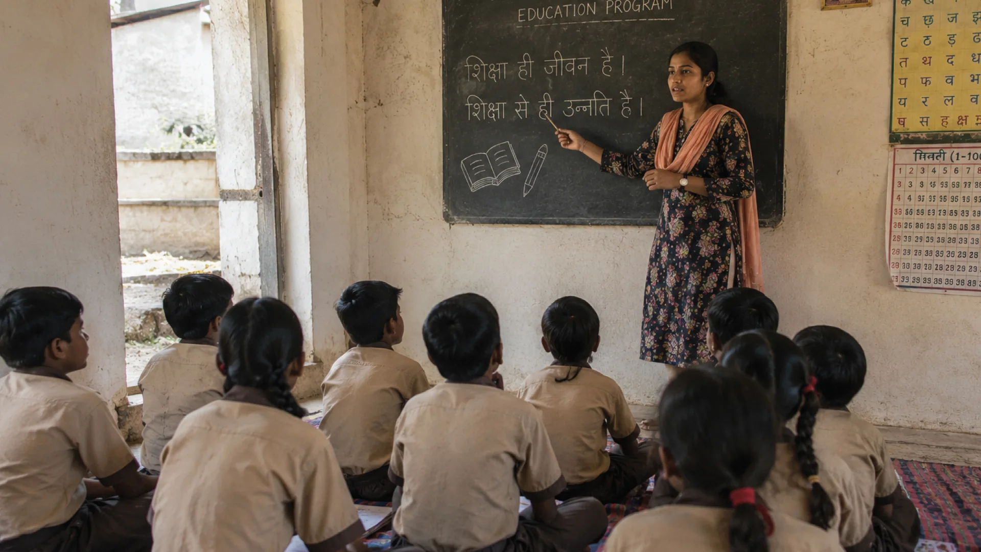 A teacher with students in a classroom